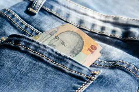 Close-up of  banknote of  10  ron    on the  back pocket jeans  . Stock Photos
