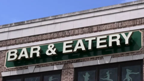 Close up Bar and eatery sign day time blue sky morning time Stock Footage 207885568