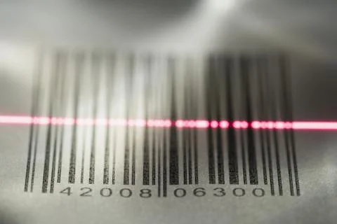 Close-up of a bar code being scanned with a laser light Stock-Fotos