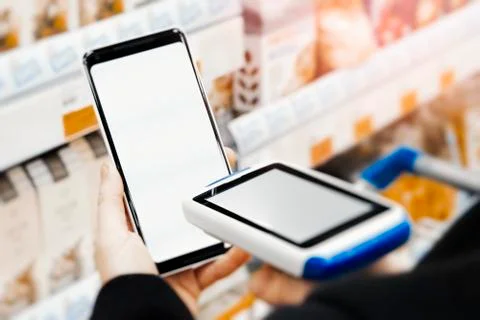 Close up of bar code scanner scanning mobile phone blank screen. Foto stock