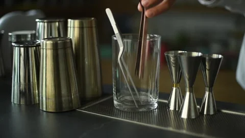 Close-Up of Bar Tools on a Countertop During a Cocktail Mixing Demonstration Stock Footage 278740439