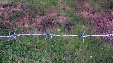 Close up of barbed wire panning from right to left Stock Footage 109370565