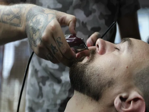 Close up barber's hands with tattoo. Stock Footage 80453647