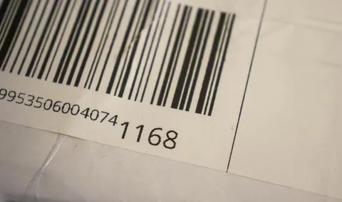 Close-up of a barcode on a package. The image highlights logistics and retail. Stock Photos