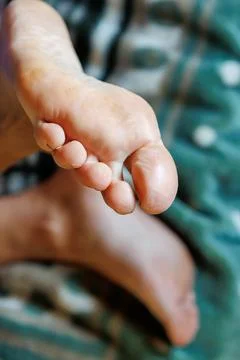 Close-up of bare human foot on soft green surface Stock Photos
