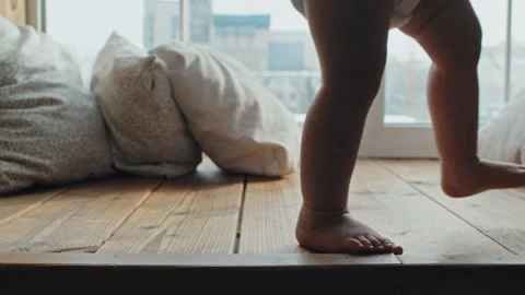 Close Up Of Barefoot Baby Making First Steps on Window Sill Vídeos de archivo 240998762