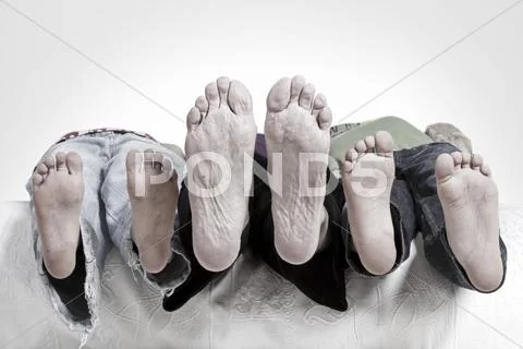 Close up of barefoot of children and grandma Stock Photos