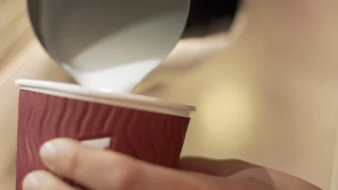 Close up of barista decorating cup of coffee in slow motion, Portugal Stock Footage 129067654
