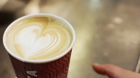 Close up of barista decorating cup of coffee in slow motion, Portugal Stock Footage 129067706