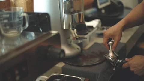 Close up on barista hand making coffee in coffee shop, slow motion 120fps Stock Footage 87370571