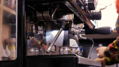 Close up barista is using a coffee maker machine in coffee shop Stock Footage