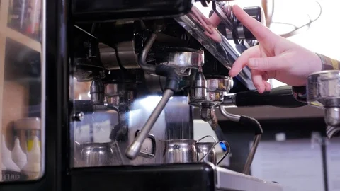 Close up barista is using a coffee maker machine in coffee shop Stock Footage 106816658