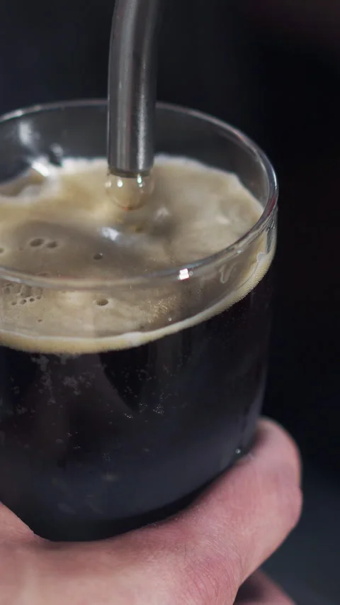 Close up of barman's hand pouring beer from the beer tap into the glass Stock Footage 274058306