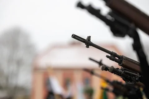 A close-up of the barrel of the m-16 machine gun on a blurred background Stock Photos