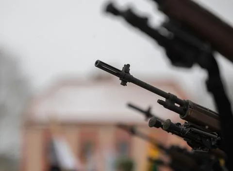 A close-up of the barrel of the m-16 machine gun on a blurred background Stock Photos