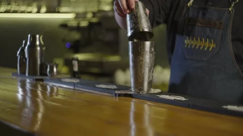 Close-up of a barsen closing a shaker. Preparation alcoholic cocktail. Stock Footage 236380829