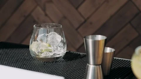 A close-up of a bartender making cocktails at a buffet Stock Footage 309496747
