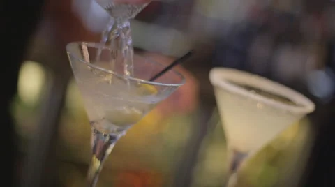 Close up of a bartender pouring a martini on the bar of a restaurant Stock Footage 42125039