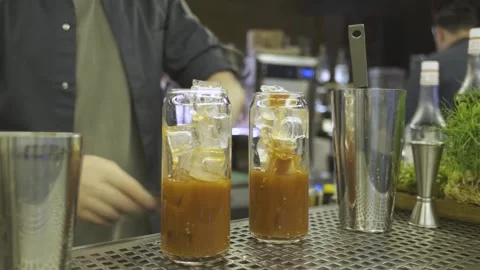 Close-up bartender preparing a cocktail with ice Stock Footage 247028857