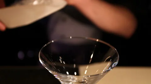 Close-up of bartender puts ice cubes into glass Video stock 43244353