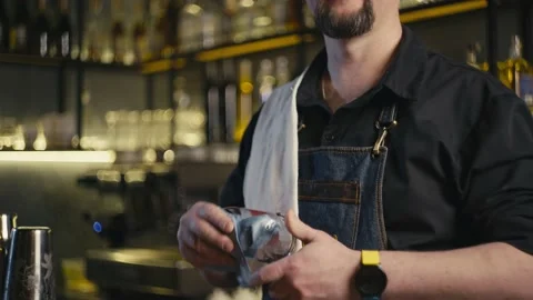 Close-up of a bartender rubbing a beer glass. Stock Footage 232617838