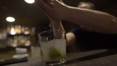 Close up bartender shaking cocktail. Preparing cocktail at the restaurant Stock-Footage 104017985