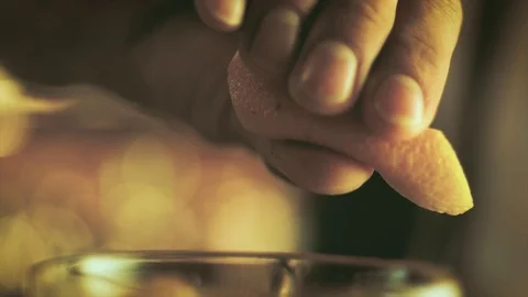 Close up of Bartender squishing lemon in cocktail drink after shaking mixing Stock Footage 103856732