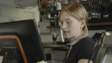 Close up of bartender talking to customer at cash register / Doolin, Clare, 스톡 동영상 242013102