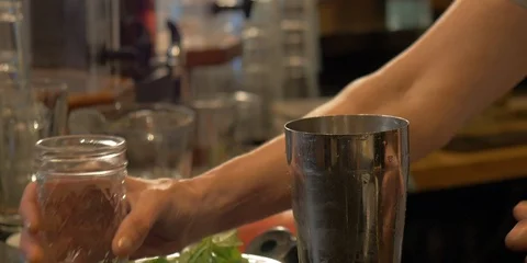 Close-up of a bartender using a cocktail shaker. Stock Footage 114193160