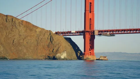 Close on base of Golden Gate Bridge support tower and Marin Headlands cliffside Video stock 242831842