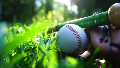 Close-up that baseball and the equipment is placed on the lawn Stock Footage 108647373