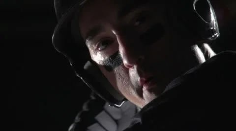 Close up of a baseball players face as he bats 動画素材 10895030