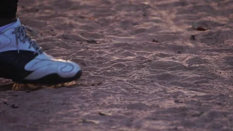 A close-up of baseball shoes dealing with the surface of the game field 스톡 동영상 143912696