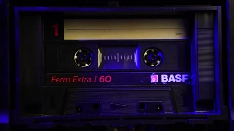 Close Up of BASF Audio Cassette Tape Spinning During Playback or Recording Stock Footage 295137409