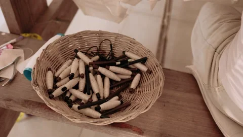 Close up of a basket filled with small spools of natural fiber thread, ready for Stock Footage 323114860