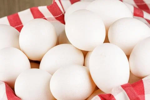 Close up of  a basket of fresh raw White Eggs Stock Photos