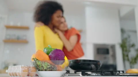 Close up basket vegetables in kitchen room and background is Happy lesbian woman Stock Footage 246533967