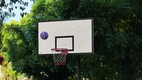 Close Up of Basketball Bouncing on the Rim Before Dropping into the Hoop. Stock Footage 339000274