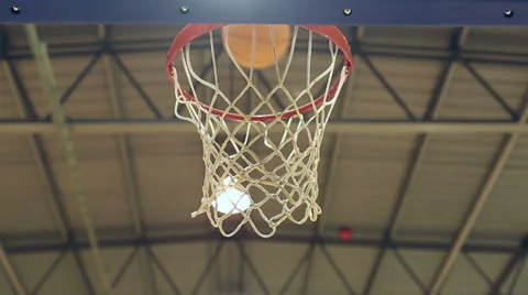 Close up of a basketball going through the net Stock Footage 37975902