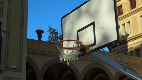 Close up of a basketball going through the net Stock Footage 83544580