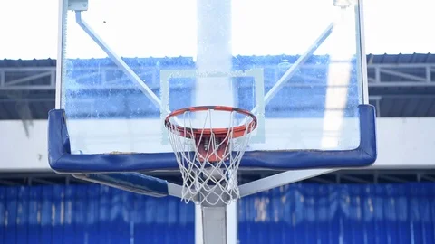 Close up of a basketball going through the net for a field goal. Stock Footage 97522327