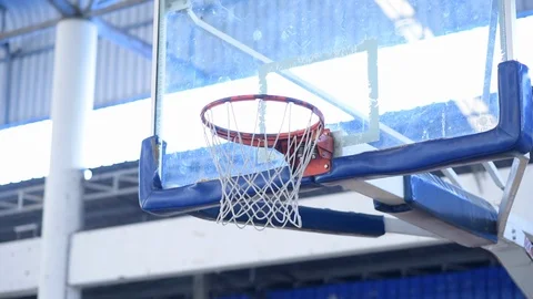 Close up of a basketball going through the net for a field goal. Stock Footage 97522993