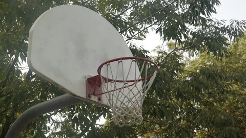 Close up of a basketball hoop as balls get thrown in. Stock Footage 80341899