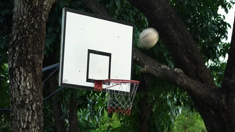 Close up of basketball spinning and dropping cleanly through the net. Stock Footage 339186503