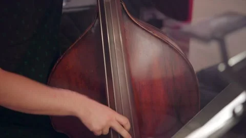 Close Up of Bassist in Recording Studio Stock Footage 258673459