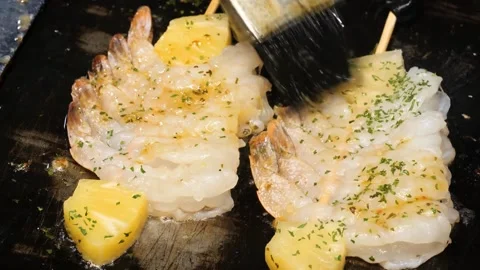 Close-up of Basting Grilled Shrimp and Pineapple Skewers with Sauce Stock Footage 337440853