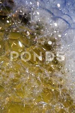 Close Up of Bath Water Bubbles Foam For Background In Rainbow Stock Photos