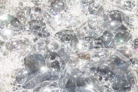 Close Up of Bath Water Bubbles Foam For Background In Rainbow Stock Photos