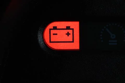 Close-up of the battery charge indicator light on the dashboard of the car. Stock Photos