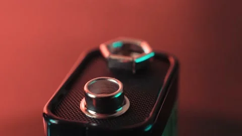 Close-up battery rotating with colored highlights and reflections Stock Footage 171039897